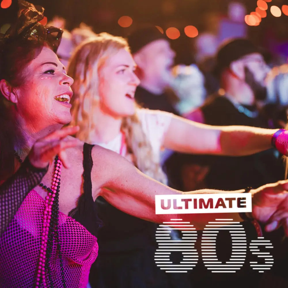 People dancing at a Butlins Adult weekender concert with 'Ultimate 80s' branding.
