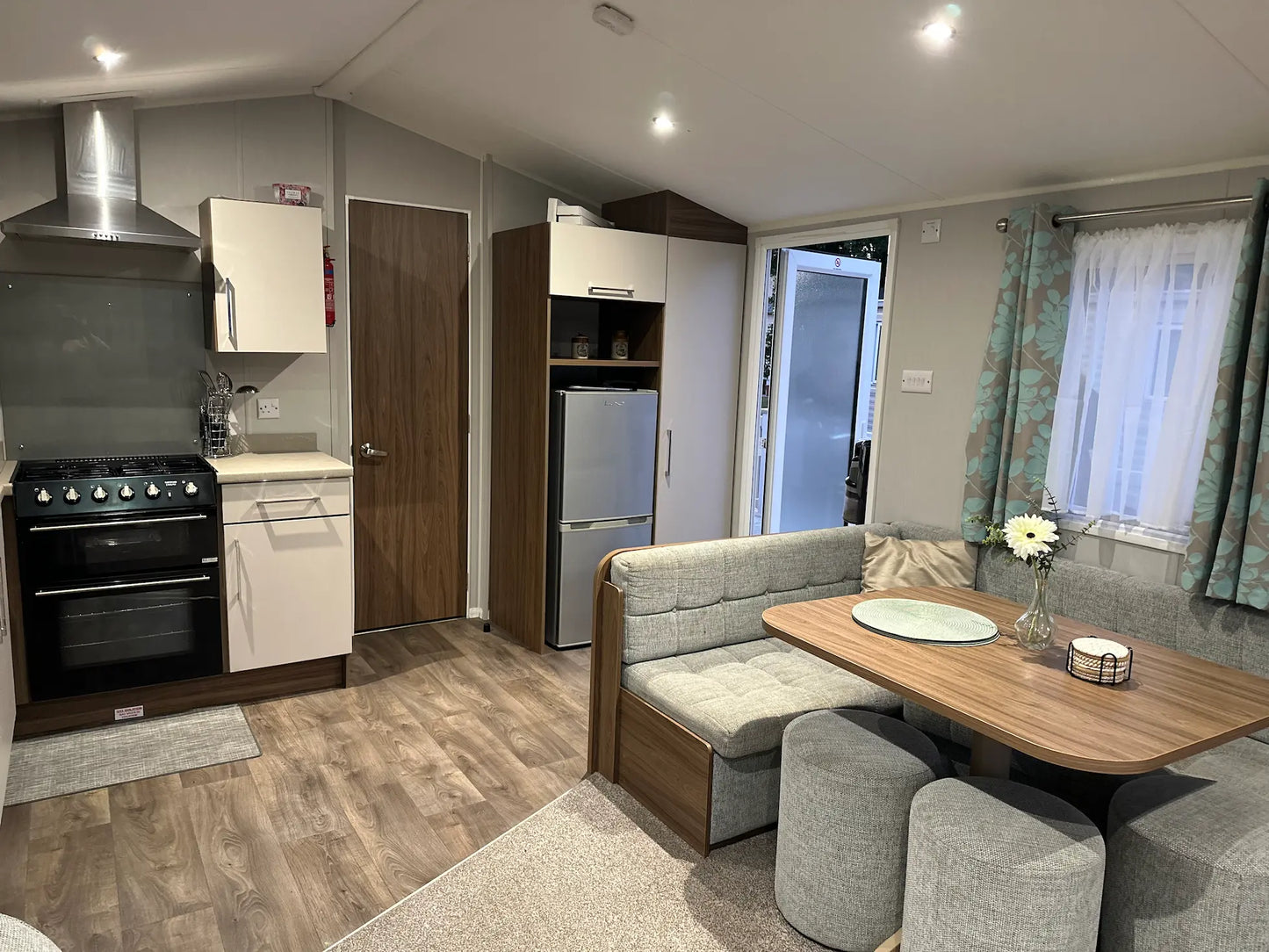 Butlins caravan interior displaying a Modern kitchen and dining area with appliances and furniture for self-catering
