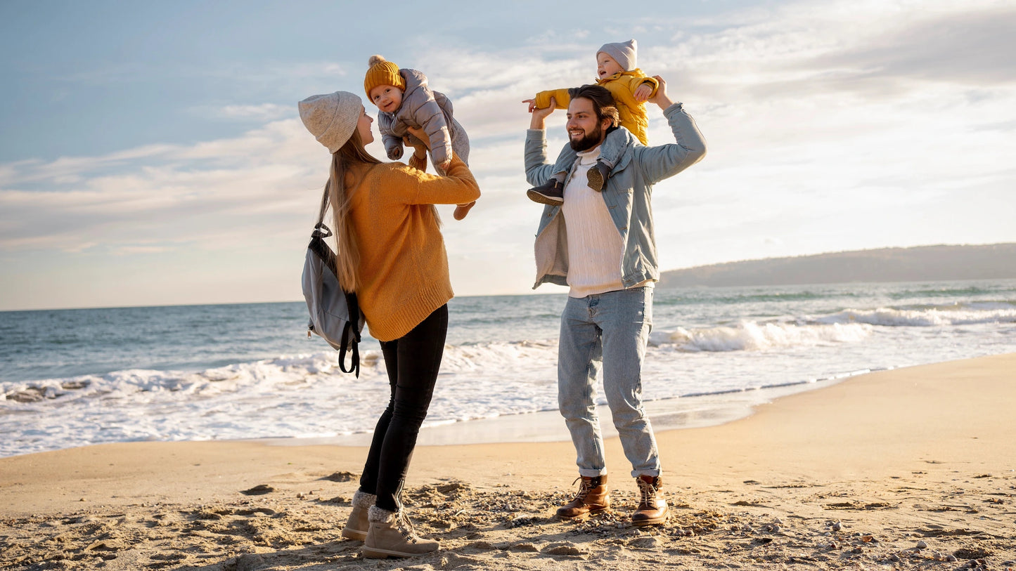 Family of four on Minehead beach with ocean view on Holiday