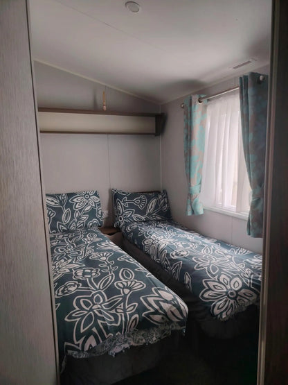 Twin bedroom at a Butlins caravan with bedding included free
