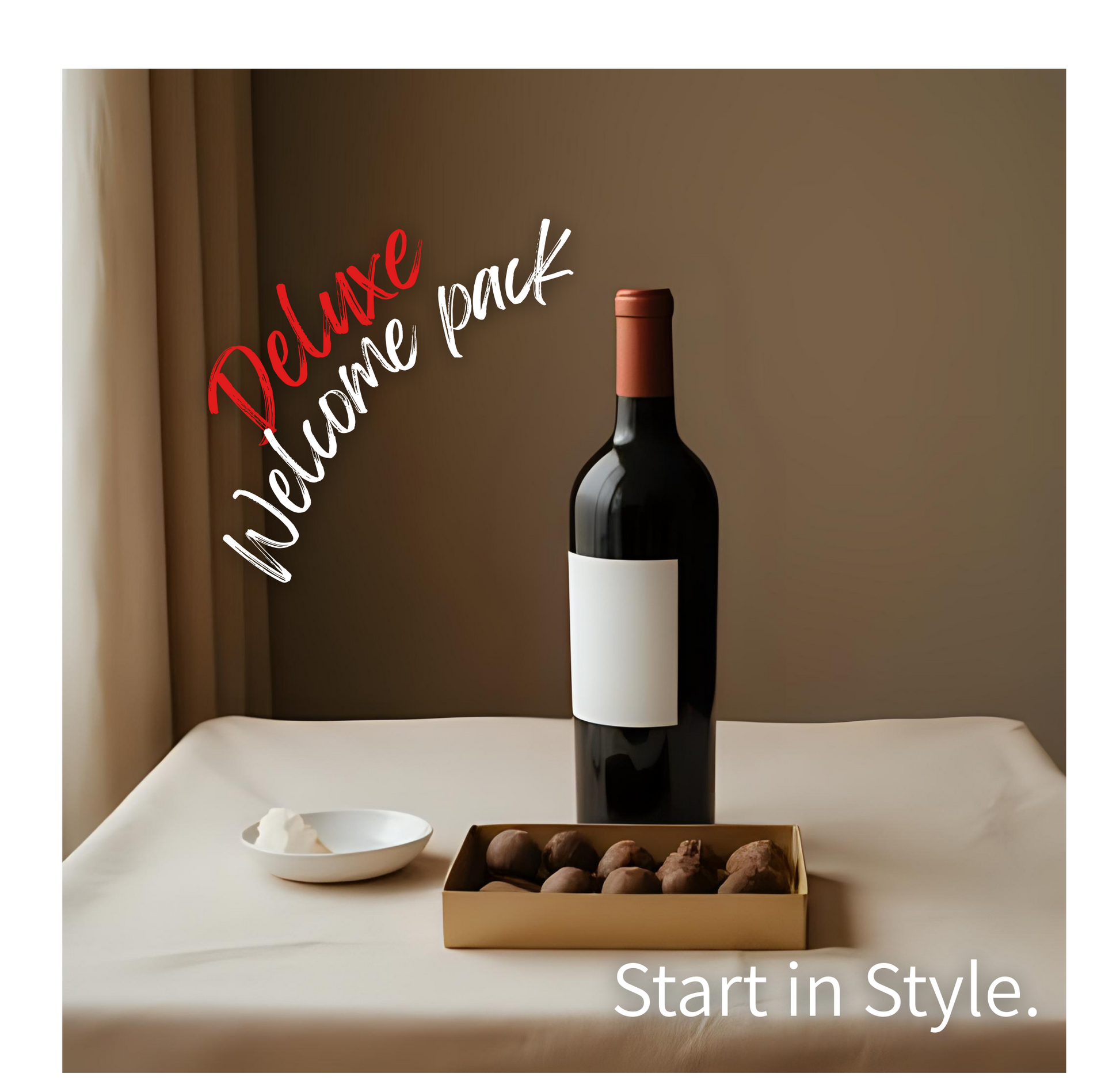 Bottle of wine with a box of chocolates and a bowl on a table, labeled 'Deluxe Welcome Pack'.